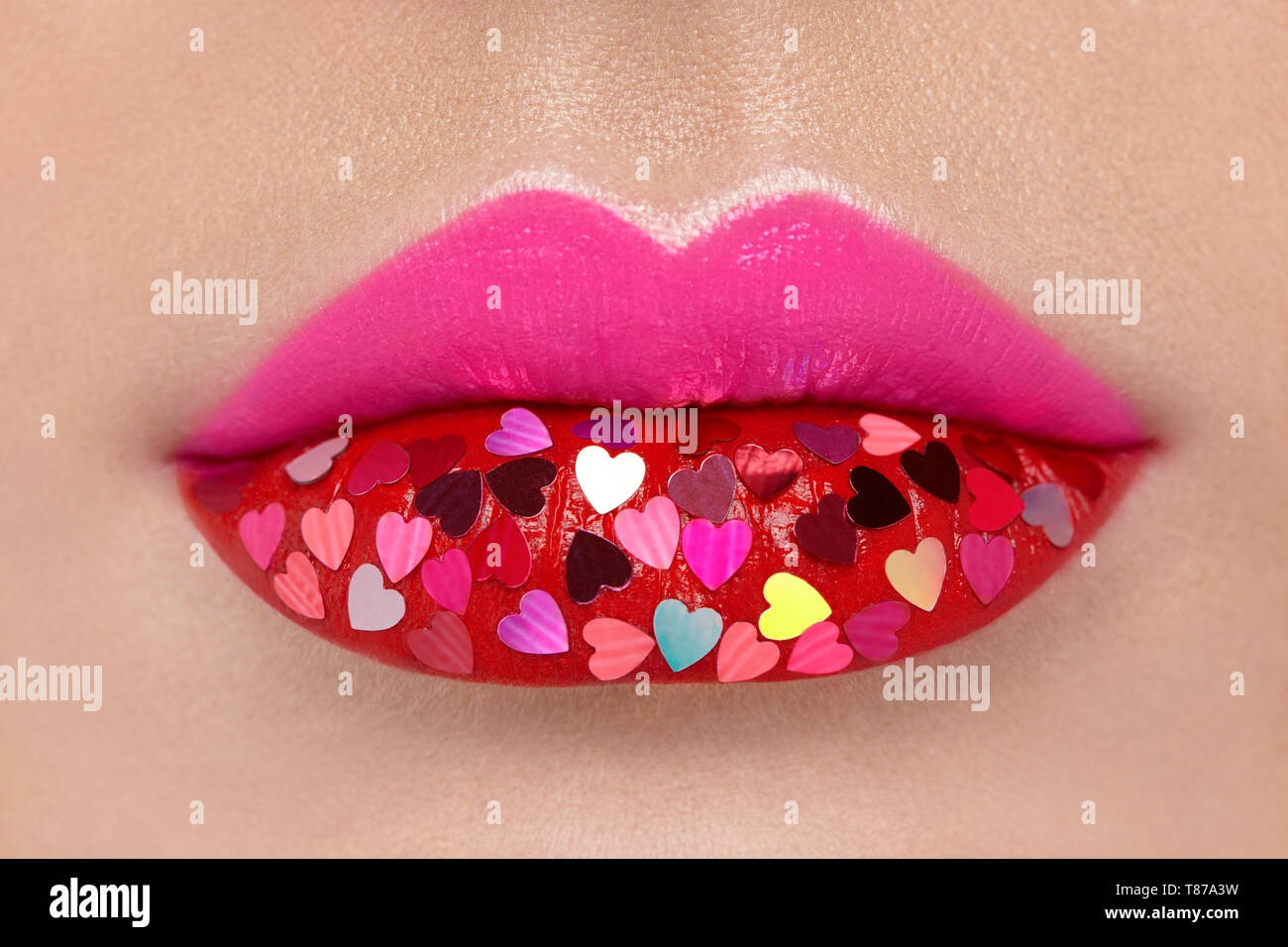 Beautiful Plump Pink Lips with pasted Hearts. Beauty Sexy Lips with Red  Lipstick. Valentine's Day. Beautiful Love Make-up Stock Photo - Alamy
