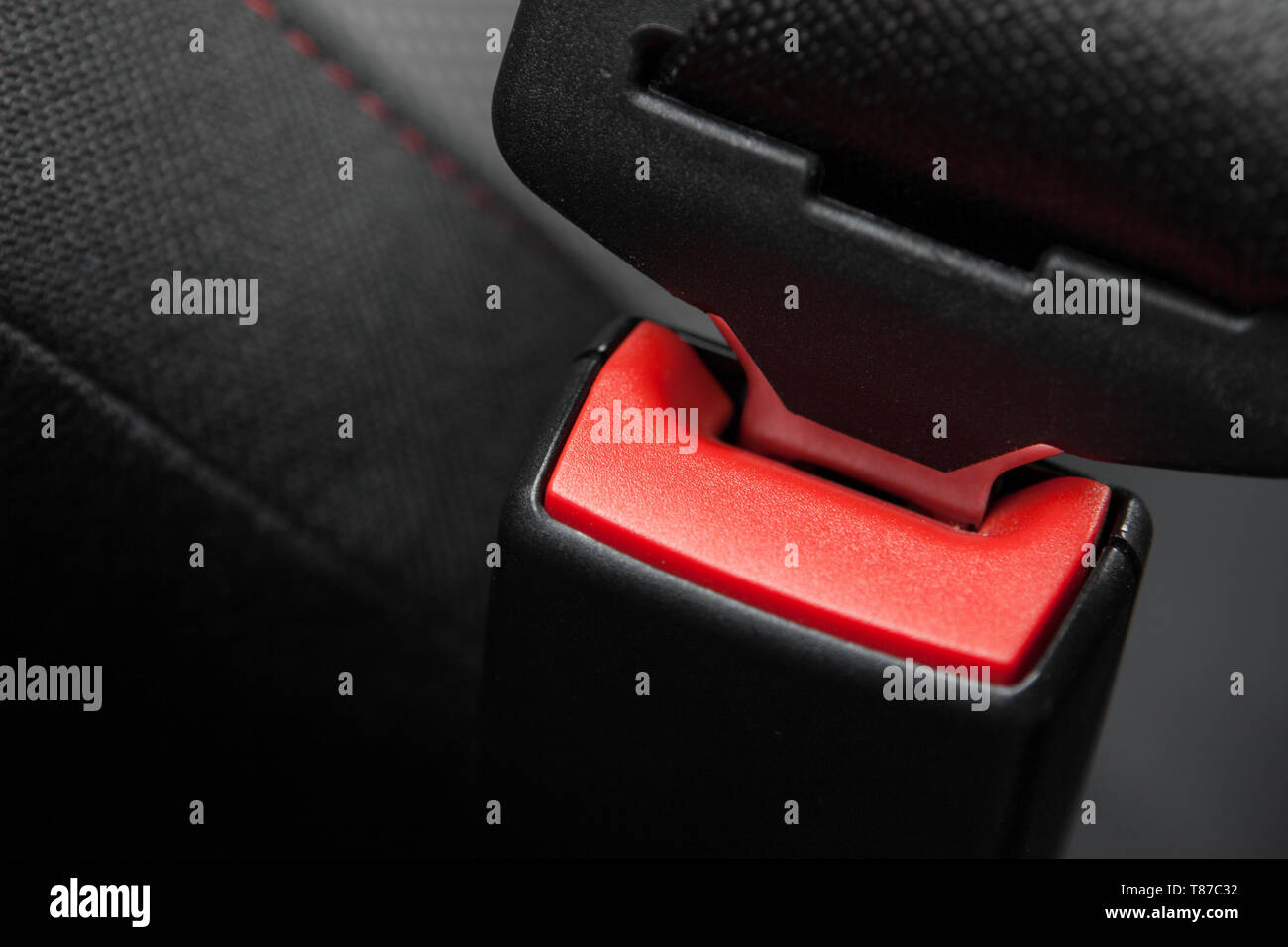 A car seat belt securely fastened for safety. Stock Photo