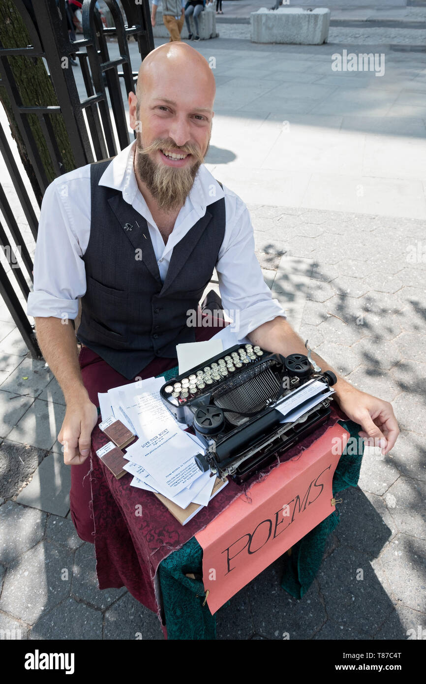POET FOR HIRE who writes personalized  poems on his typewriter for a fee. In Union Square Park in manhattan, New York City. Stock Photo