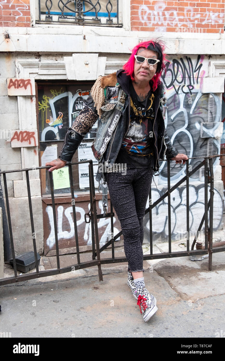 Posed portrait of Astro Erle, nightlife icon, club kid and hairstylist,. On St. Marks pLace in the East Village, New York City. Stock Photo