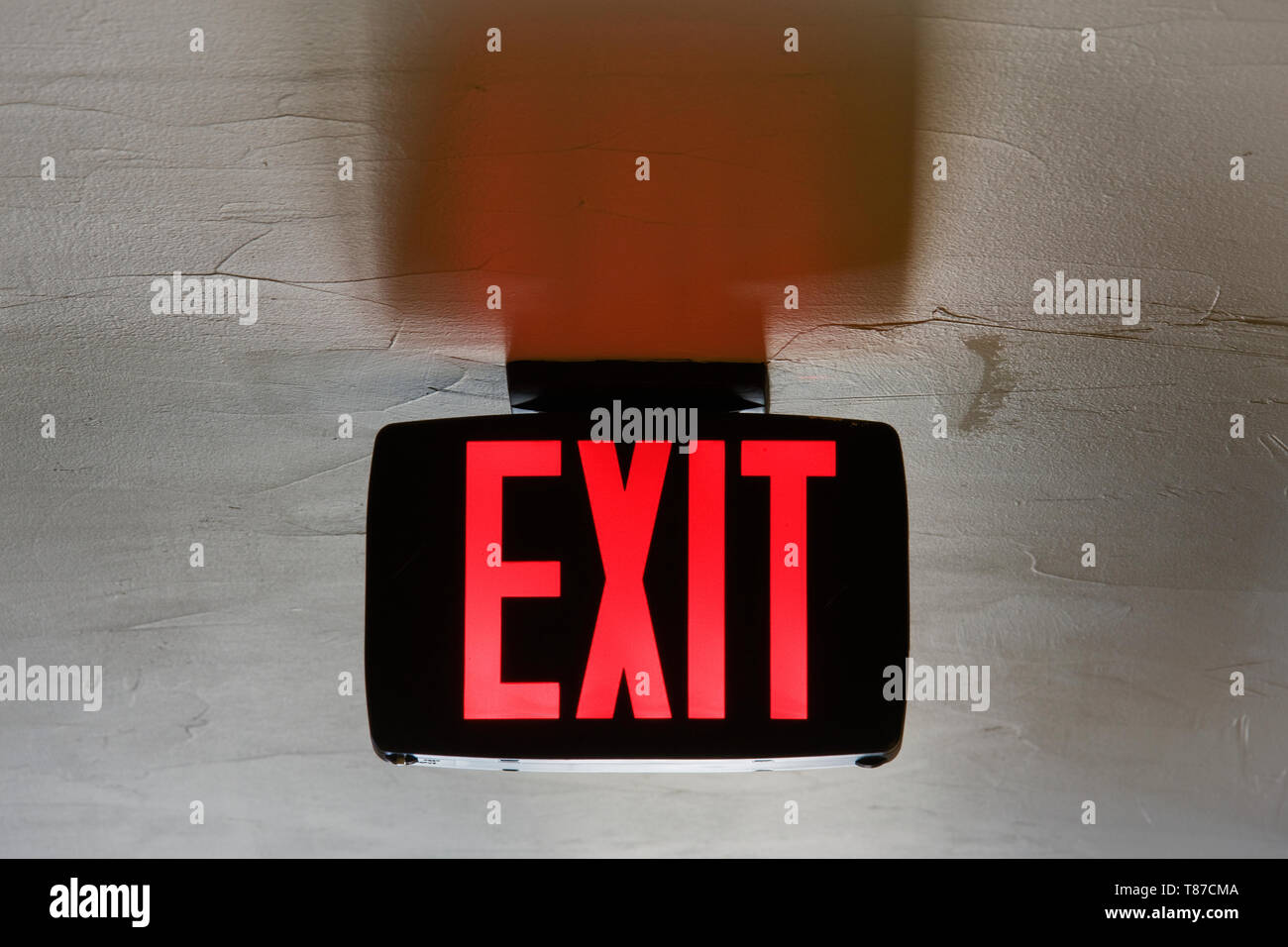 Red Exit Sign on Ceiling Stock Photo - Alamy