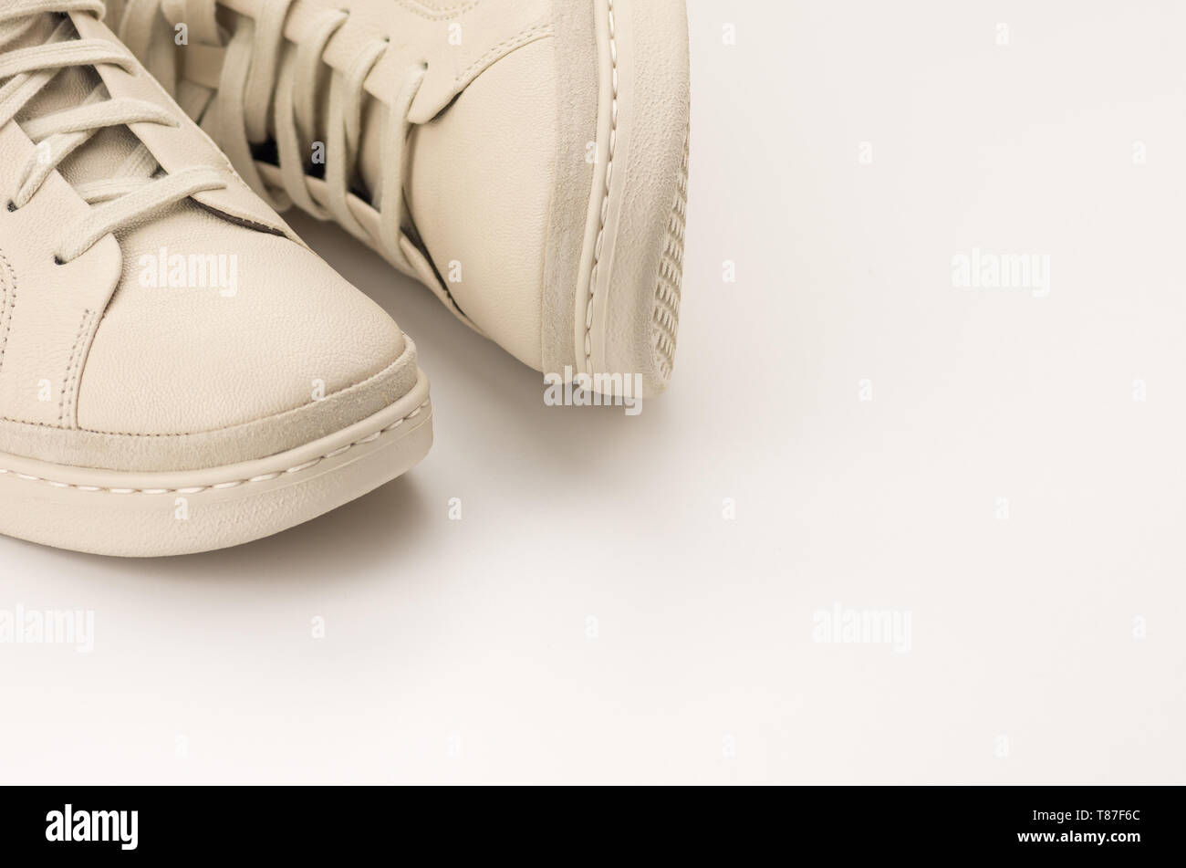 sneaker shoes on a blank surface with copy space Stock Photo