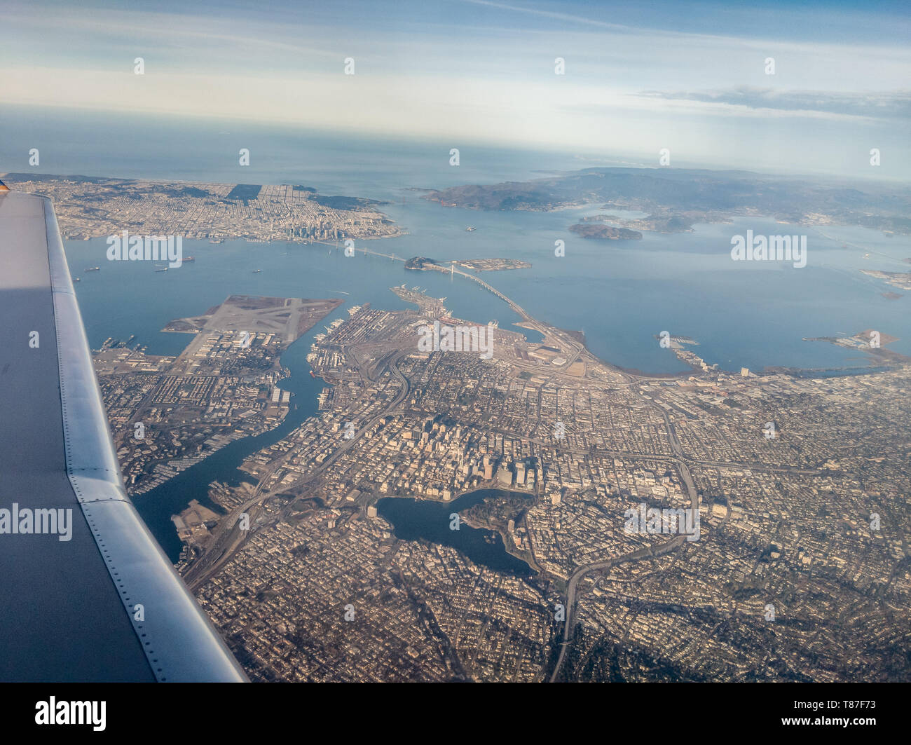 Our CRJ200 climbs out over Oakland California on its way north to Redding California Stock Photo