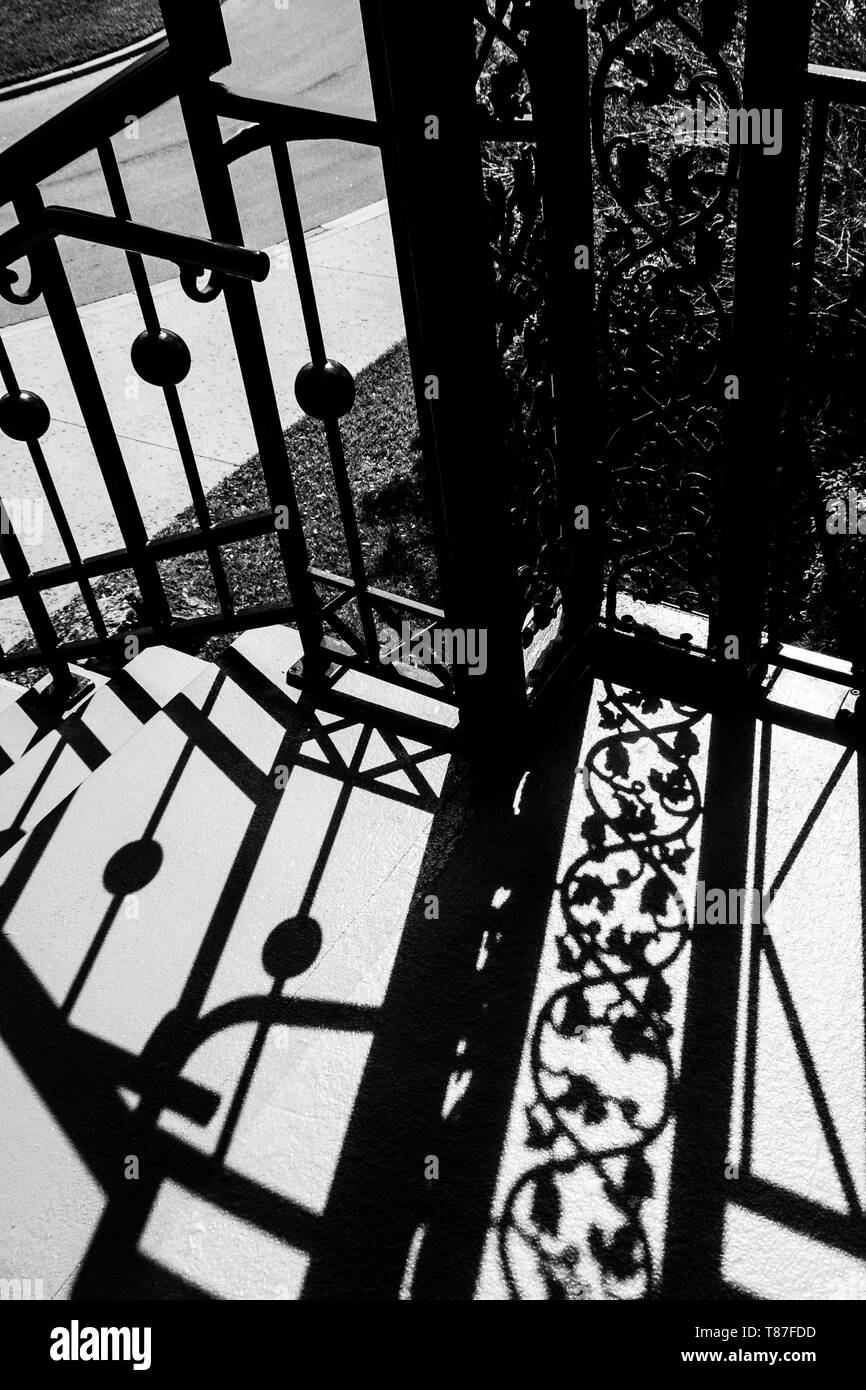 Wrought iron shadows in black and white leaves and geometric shapes Stock Photo