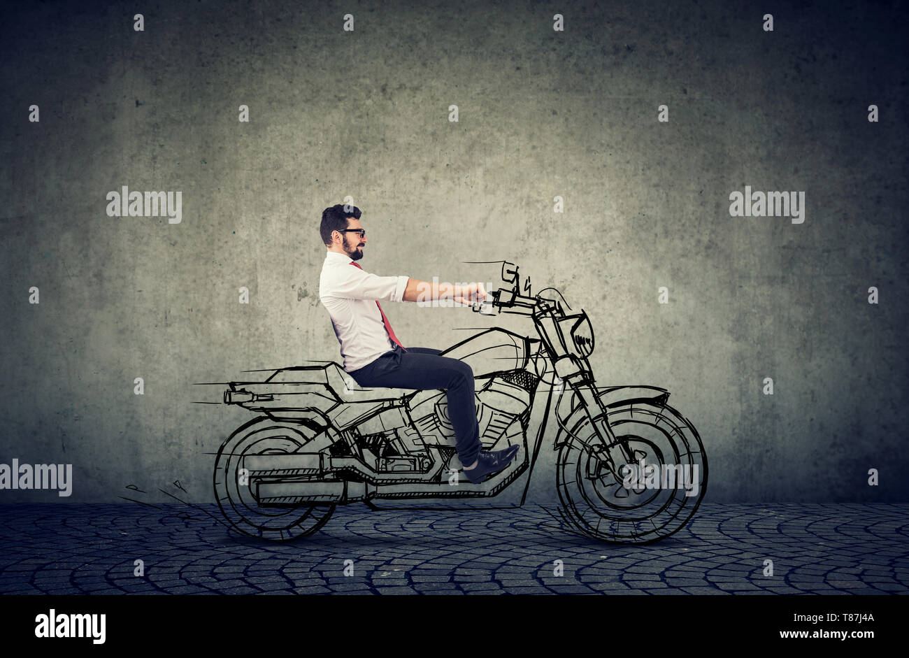 happy hipster businessman riding a motocycle Stock Photo