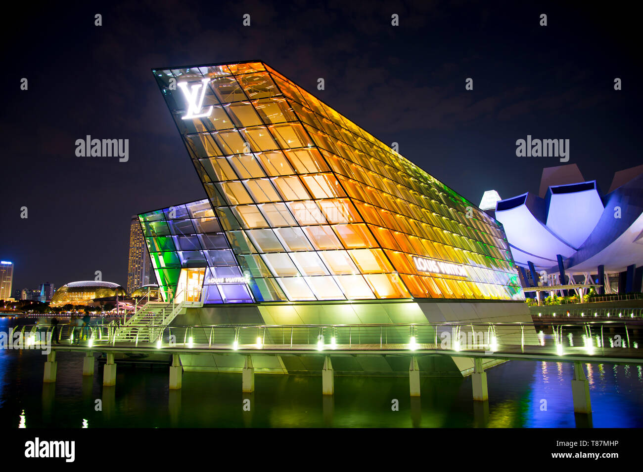 Louis Vuitton Island Maison in Marina Bay, Singapore, and accessible by a  pedestrian bridge or underground from The Shoppes at Marina Bay Sands Stock  Photo - Alamy