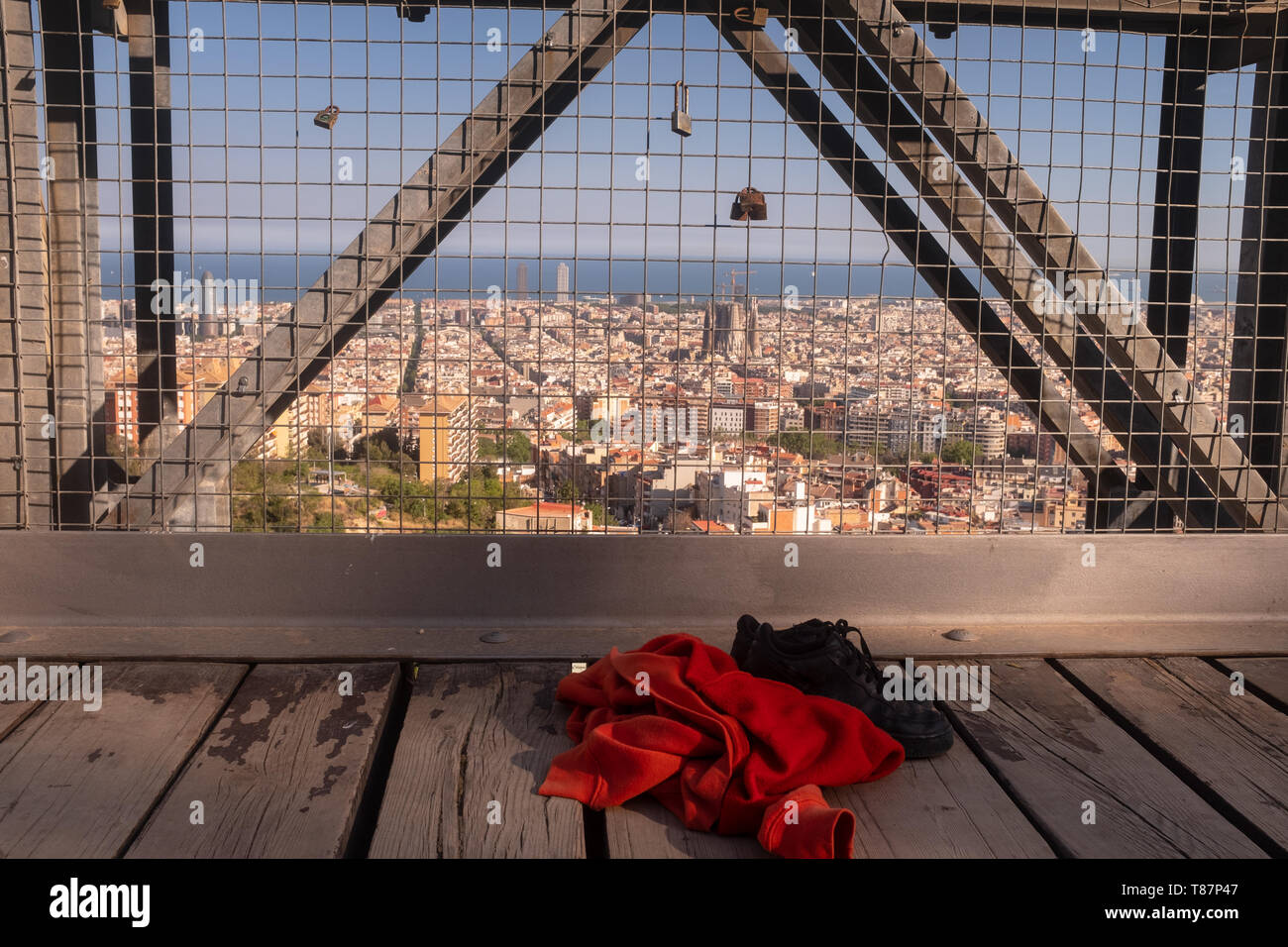 Sweatshirt and shoes of a girl who could have committed suicide by jumping off a bridge, concept stop teenage suicide, the city of Barcelona in the ba Stock Photo