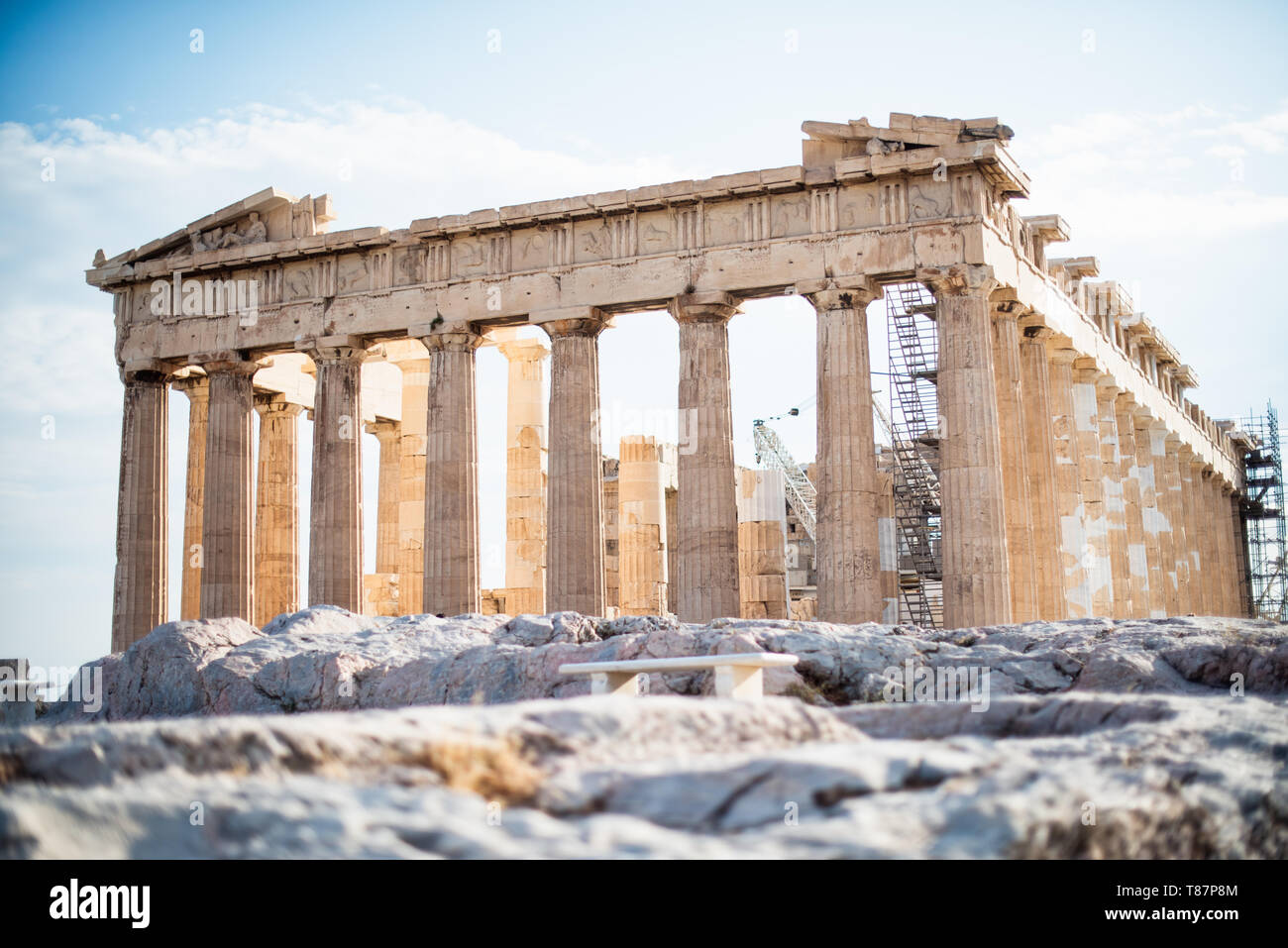 ATHENS, Greece - The Acropolis of Athens is an ancient citadel standing on a rocky outcrop above Athens, Greece. It is one of the most famous archeological sites in the world and is a UNESCO World Heritage site. It consists of a number of structures on the top of the hill, along with other sites on the surrounding hillside. The most famous structure if the Parthenon, a large temple dating back to the 5th century BC and featuring a distinctive outer layer of large columns. Stock Photo