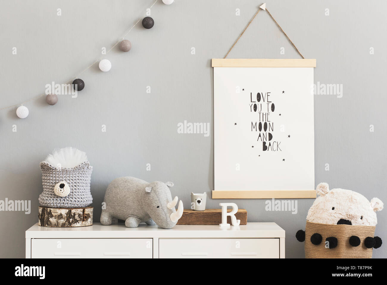 Stylish and modern scandinavian nursery interior with gray walls, brown ...