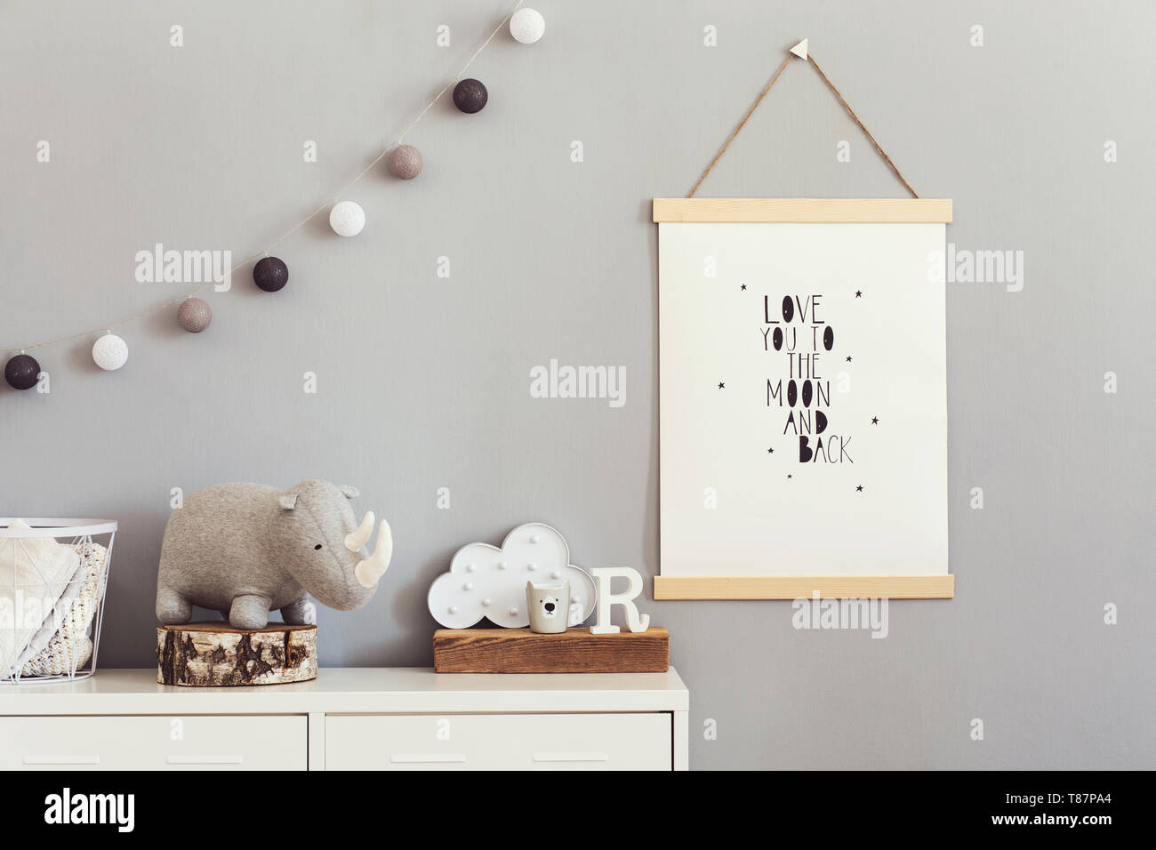 Stylish and modern scandinavian nursery interior with gray walls, brown ...