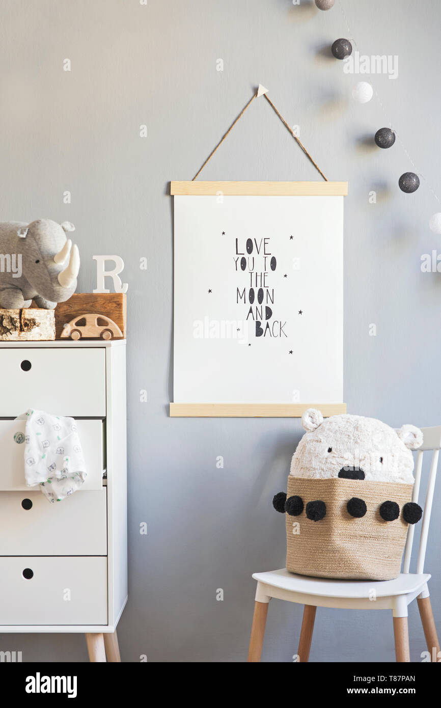 Stylish and modern scandinavian nursery interior with gray walls, brown ...