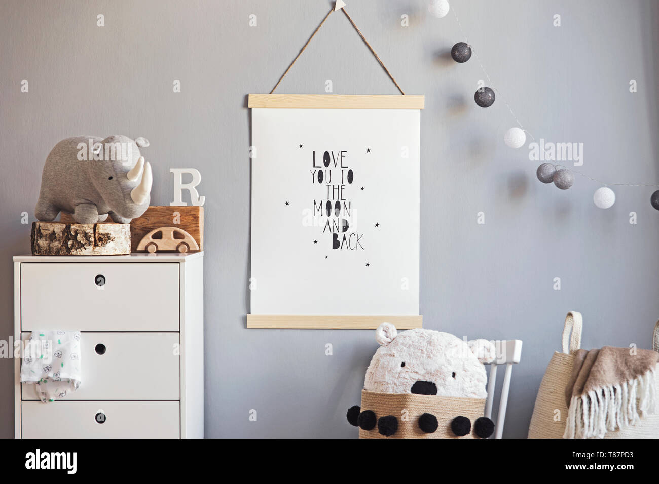 Stylish and modern scandinavian nursery interior with gray walls, brown ...