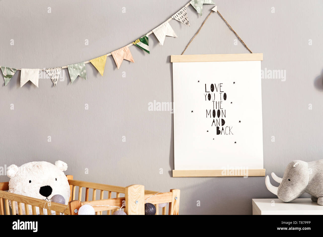 Stylish and modern scandinavian nursery interior with gray walls, brown ...