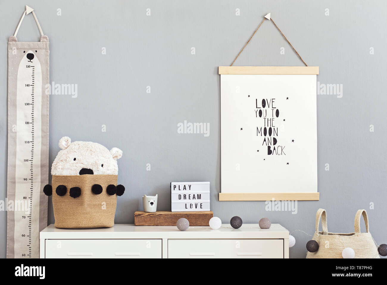 Stylish and modern scandinavian nursery interior with gray walls, brown ...