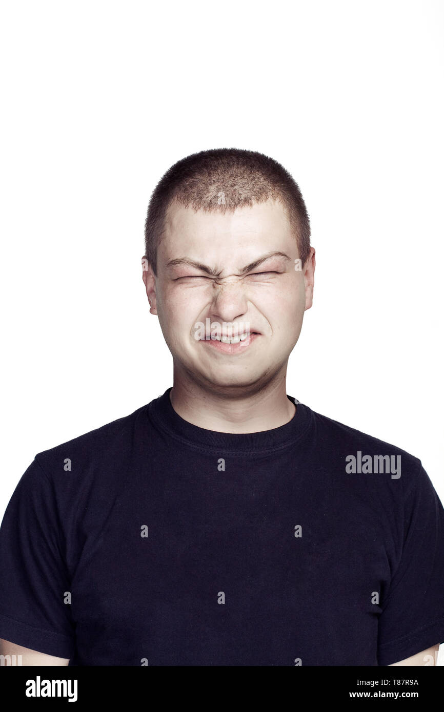 Portrait of young man. Facial expression. ugly face Stock Photo Alamy