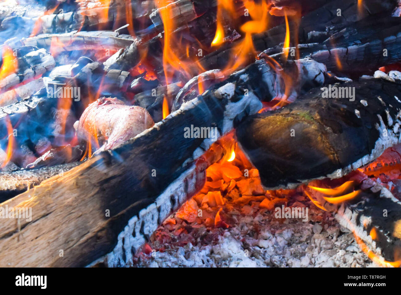 Wood burning with visible white ashes Stock Photo Alamy