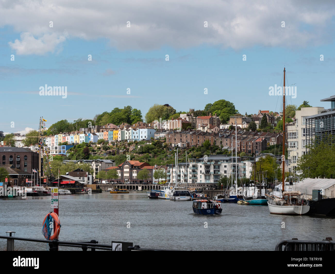 Old and coloured houses seen across Bristol Harbour, Bristol, UK Stock
