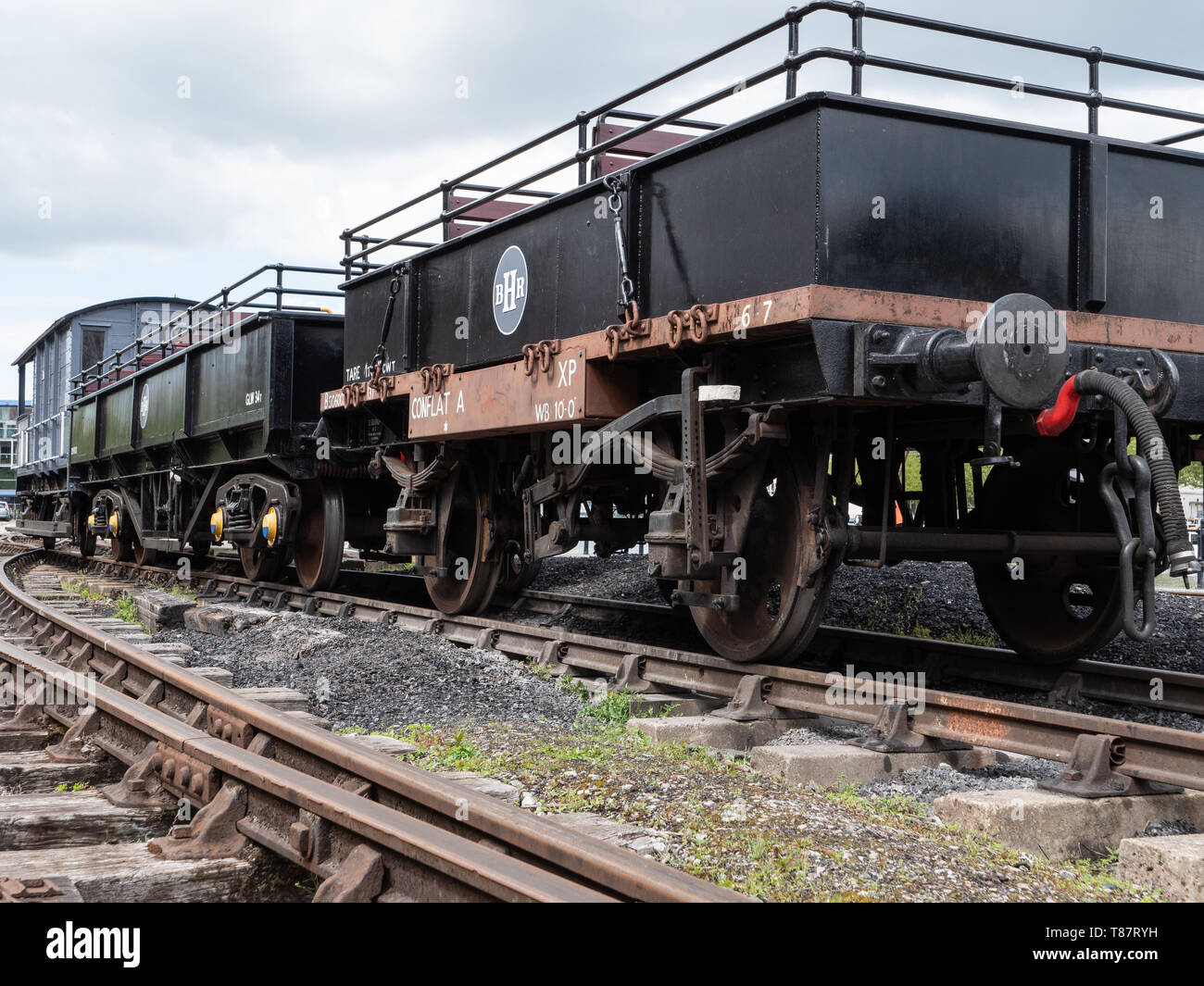 Old railway wagons on quayside at Bristol Harbour, Bristol, UK Stock