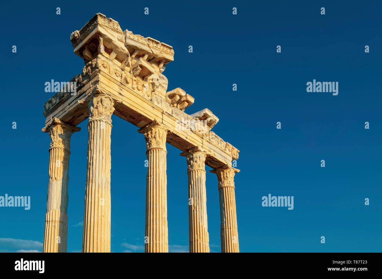 The ruins of the Temple of Apollo in ancient city of Side in Turkey against the blue sky Stock Photo