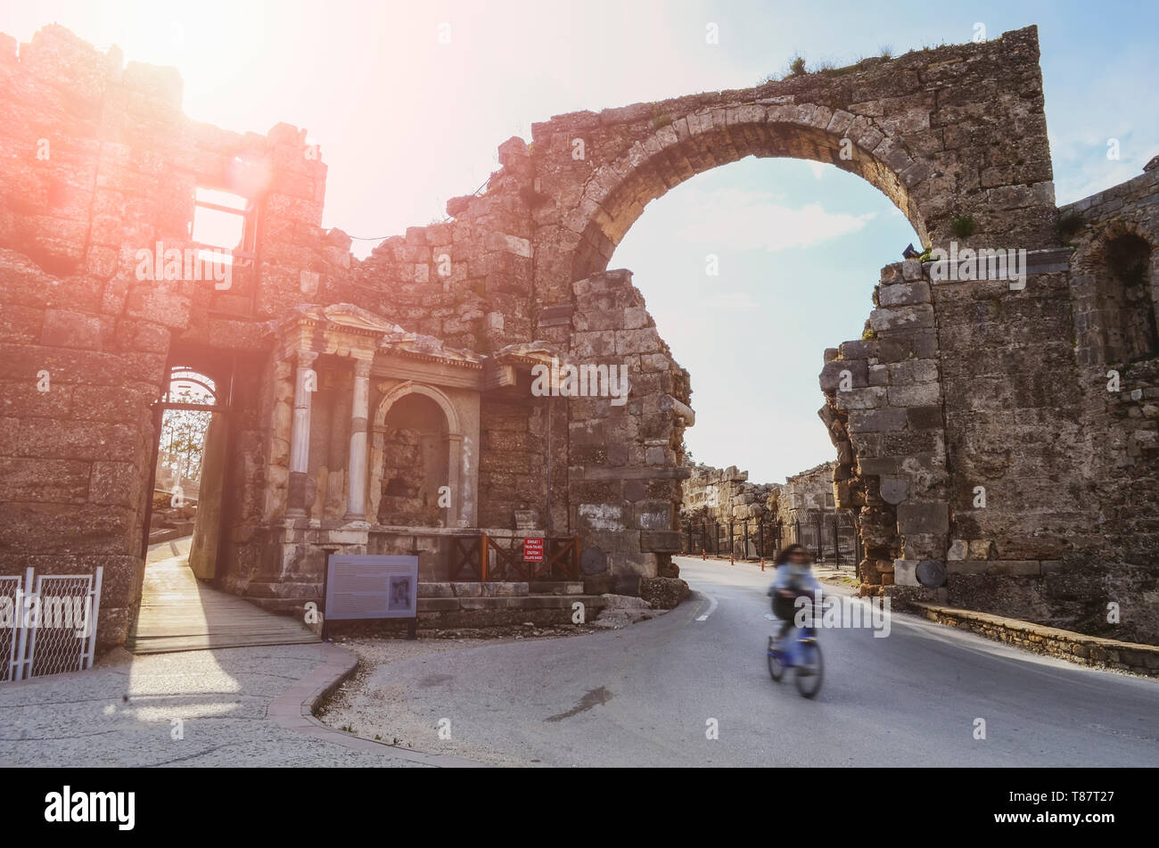 The ruins of the central gate of the ancient city of Side in Turkey in the light of the setting sun Stock Photo