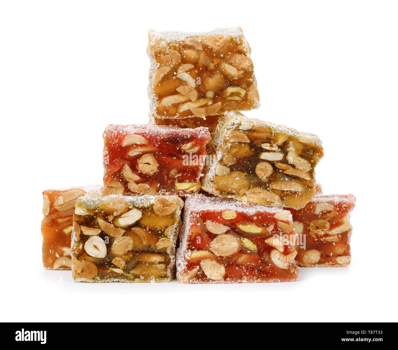 Stack of turkish delight sweets with nuts isolated on white Stock Photo