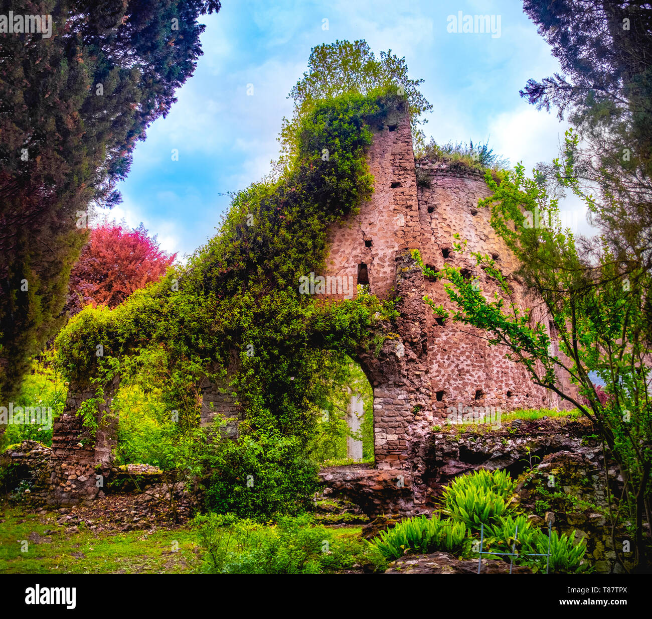 colourful ruins in Giardino della Ninfa gardens in Latina - Lazio - Italy Stock Photo