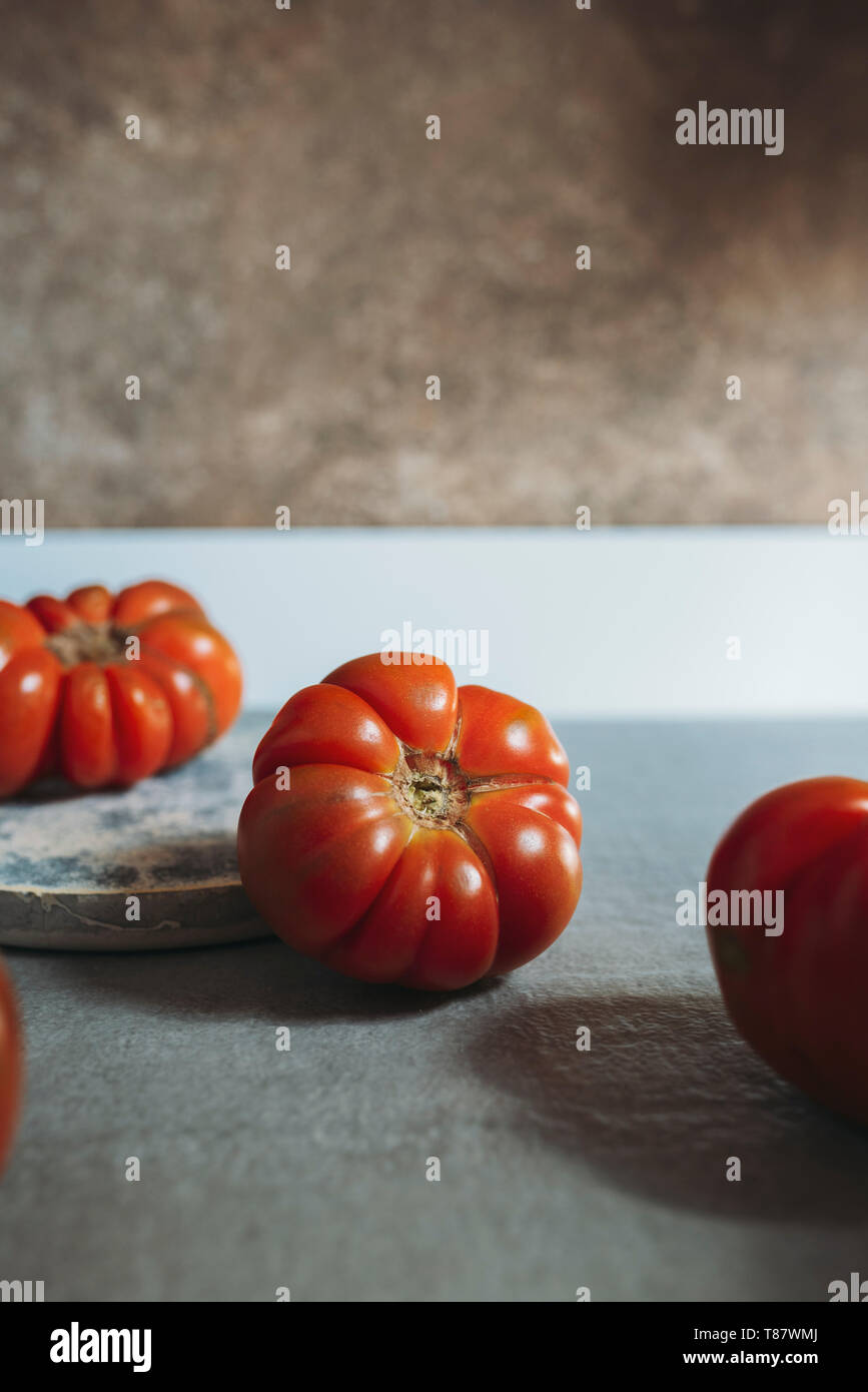 Fresh red Marmande RAF red tomatoes, on the kitchen countertop Stock Photo