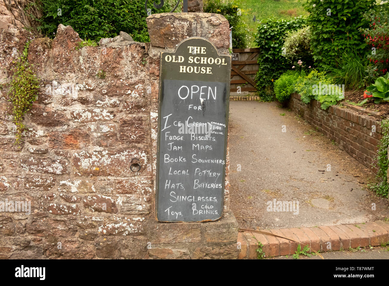 Items for sale on blackboard outside traditional village tourist shop