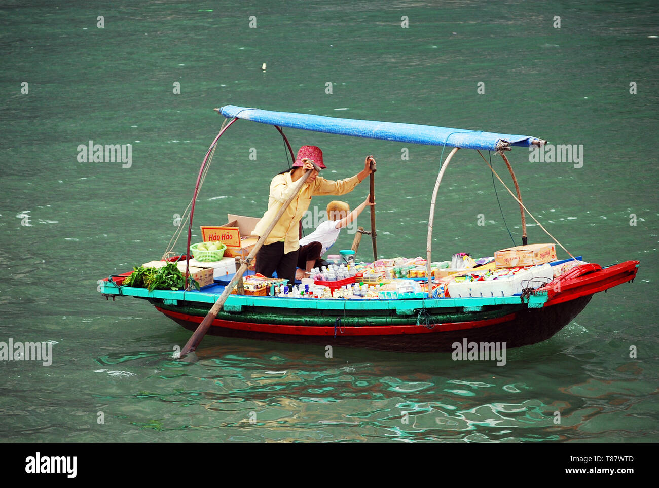 Traditional Vietnamese vendor, Halong Bay floating market, Vietnam. Stock Photo