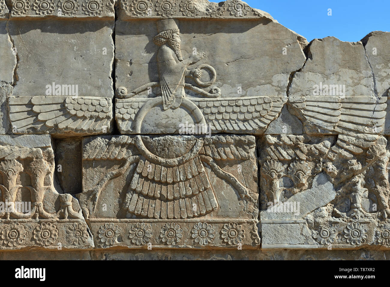 The beautiful reliefs - symbols of Zoroastrian in the ruins of Ancient Persepolis Complex of Near Eastern civilisation with persian architecture, Pars Stock Photo