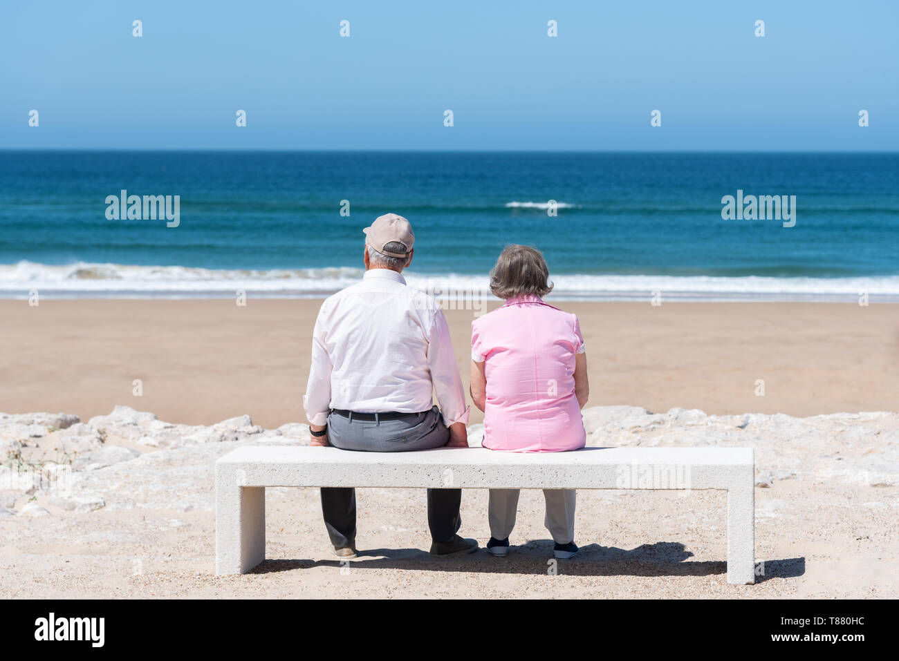 Senior couple is sitting on the bench Stock Photo
