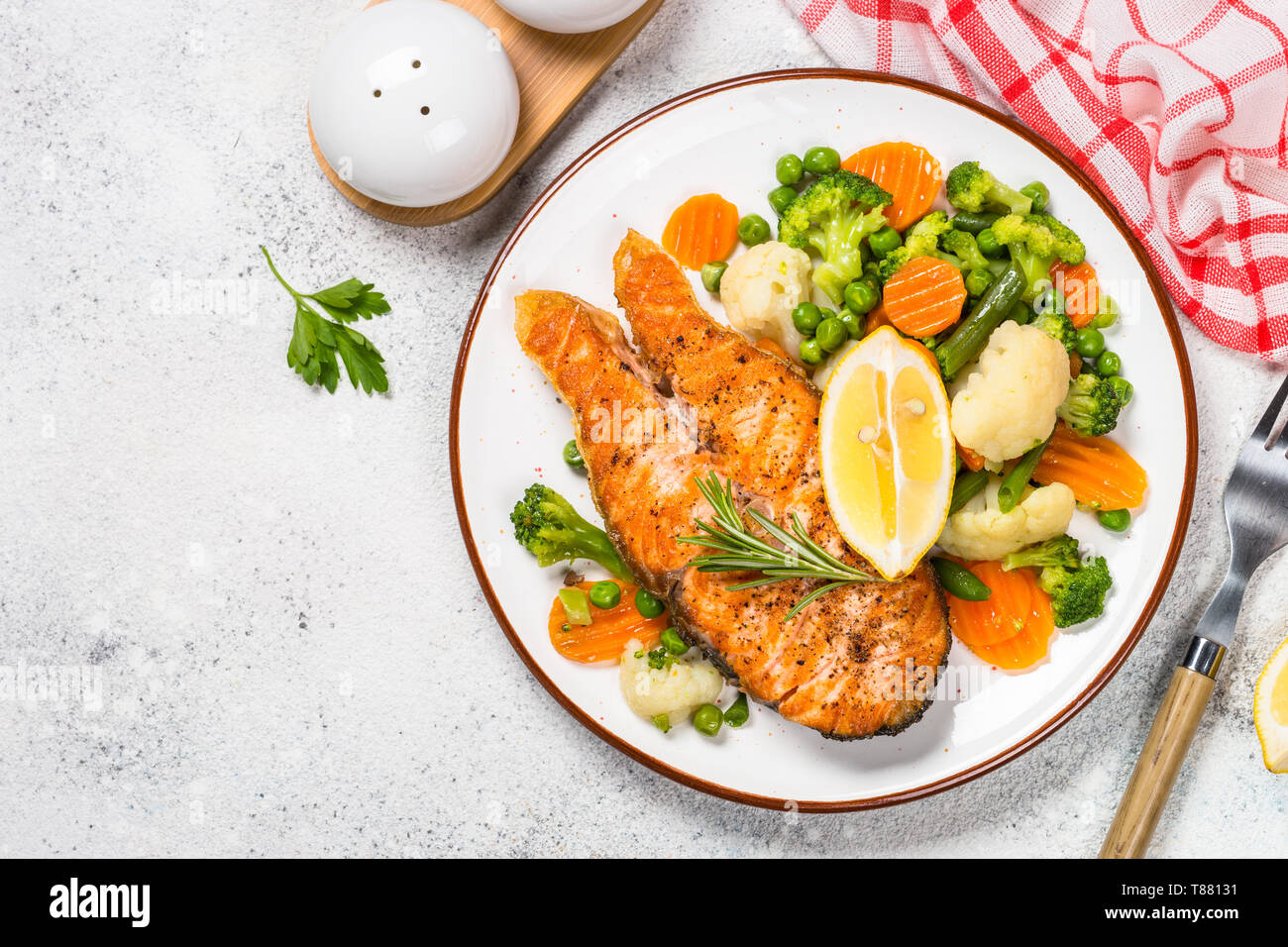 Grilled salmon fish steak with vegetables on white Stock Photo - Alamy