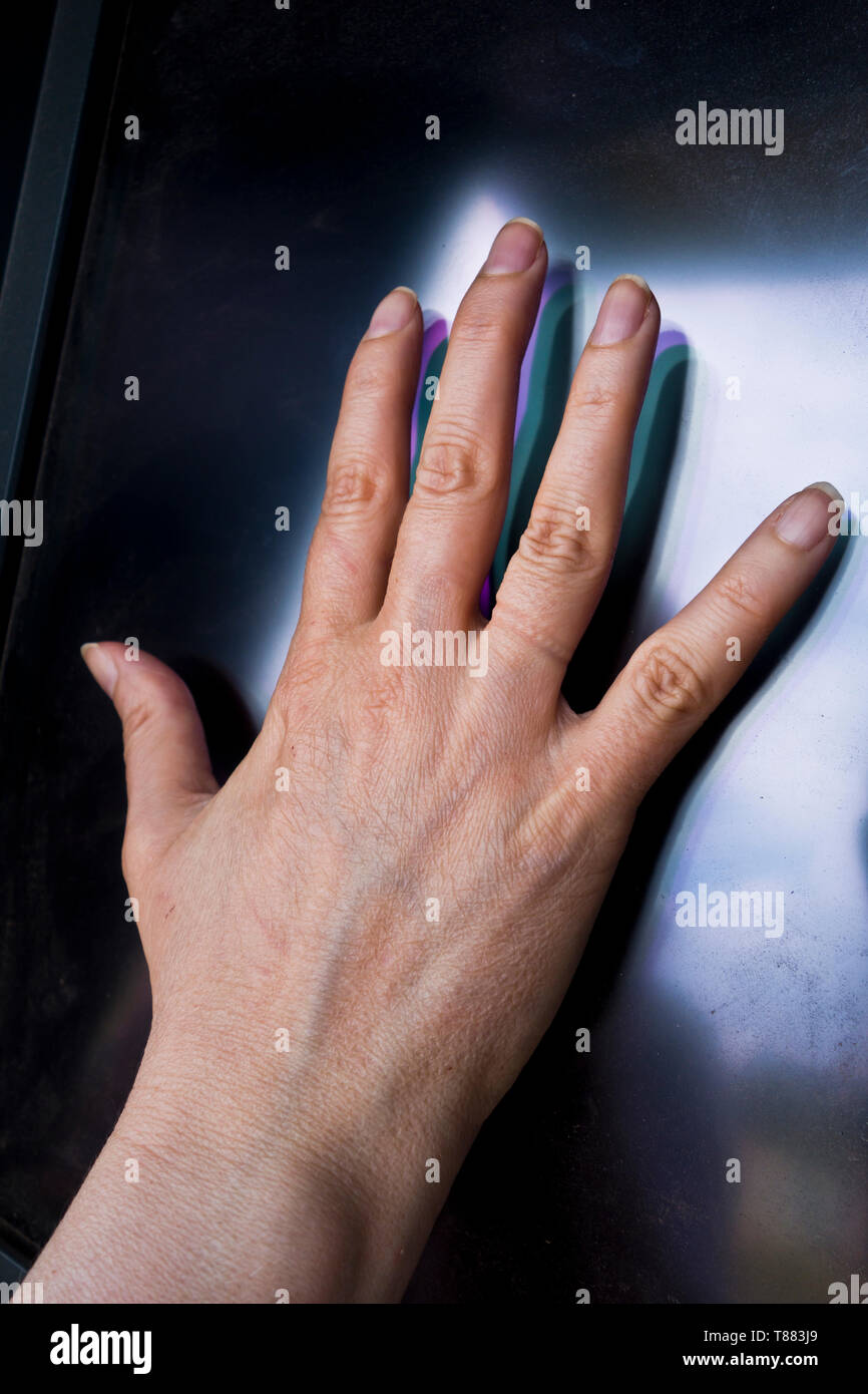 female hand on a scanner for secure identification Stock Photo