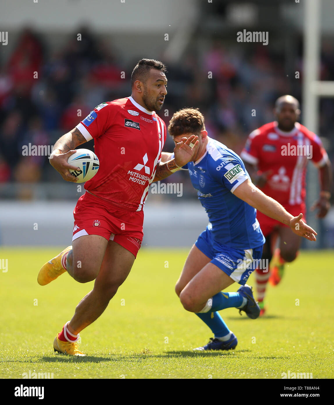 Salford Red Devils' Krisnan Inu (left) is tackled by Hull KR's Rob Mulhern during the Coral Challenge Cup match at the AJ Bell Stadium, Salford. Stock Photo