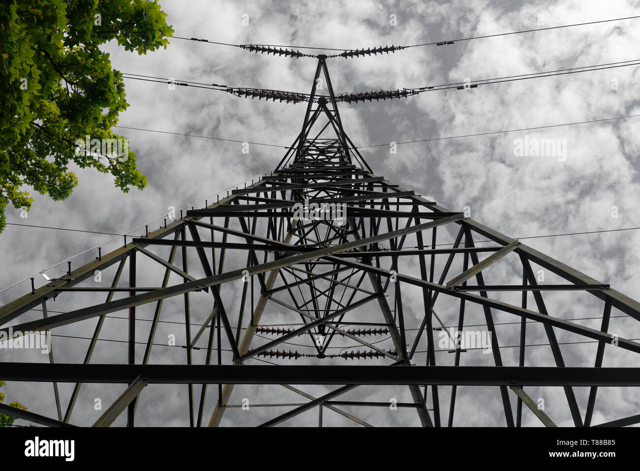Looking up from below an electricity pylon or transmission tower Stock Photo