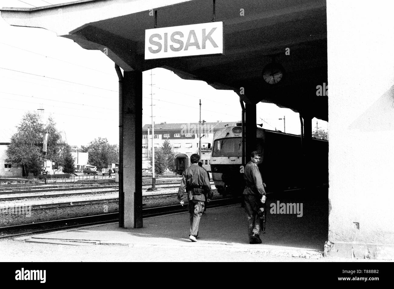 Two soldiers from the Croatian Defense Forces patrol Sisak train station during the Yugoslav break-up in 1991. Picture by Adam Alexander Stock Photo