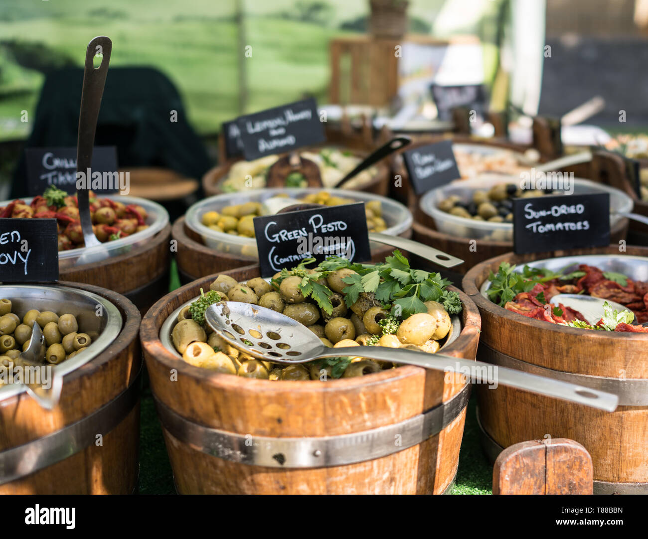 Olives and olive oil stall vendor at Christchurch food festival in