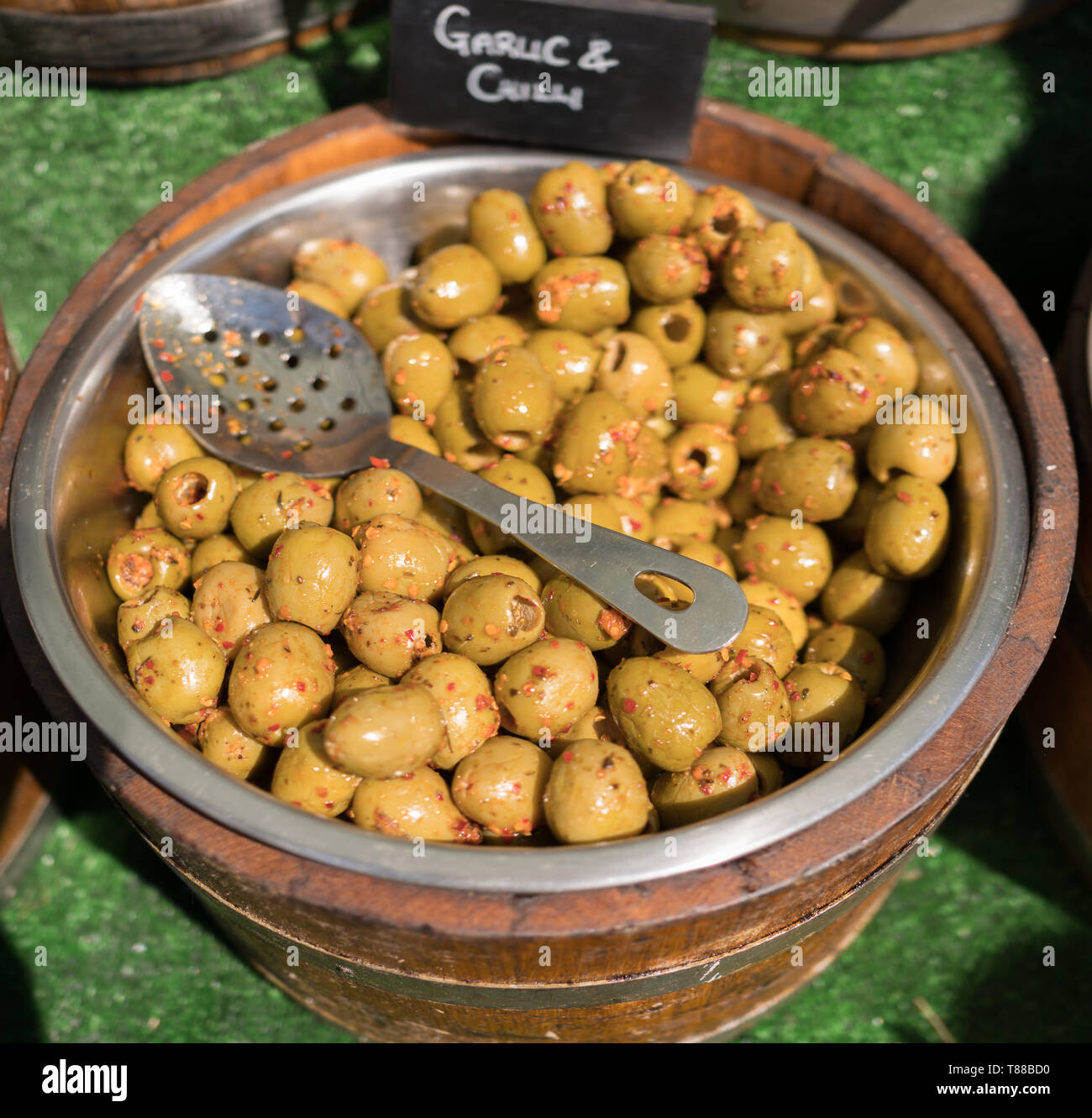 Olives and olive oil stall vendor at Christchurch food festival in