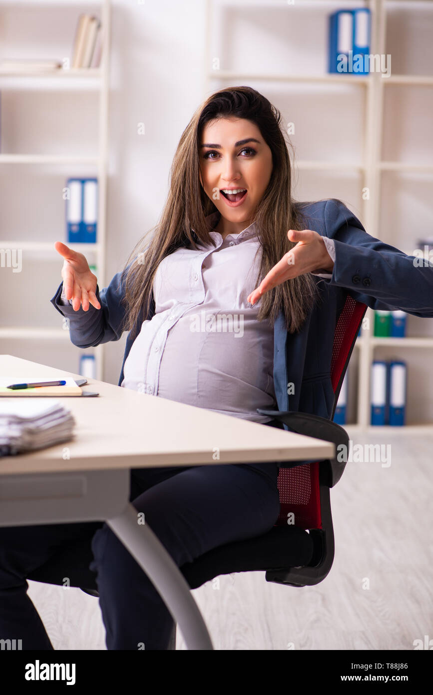 Young pregnant woman working in the office Stock Photo Alamy