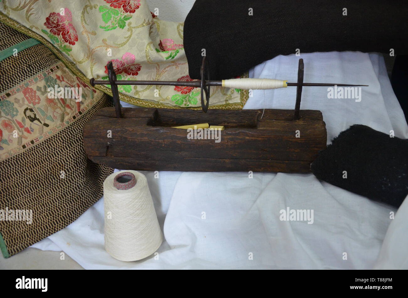 Old wool spindle and virgin wool Stock Photo - Alamy