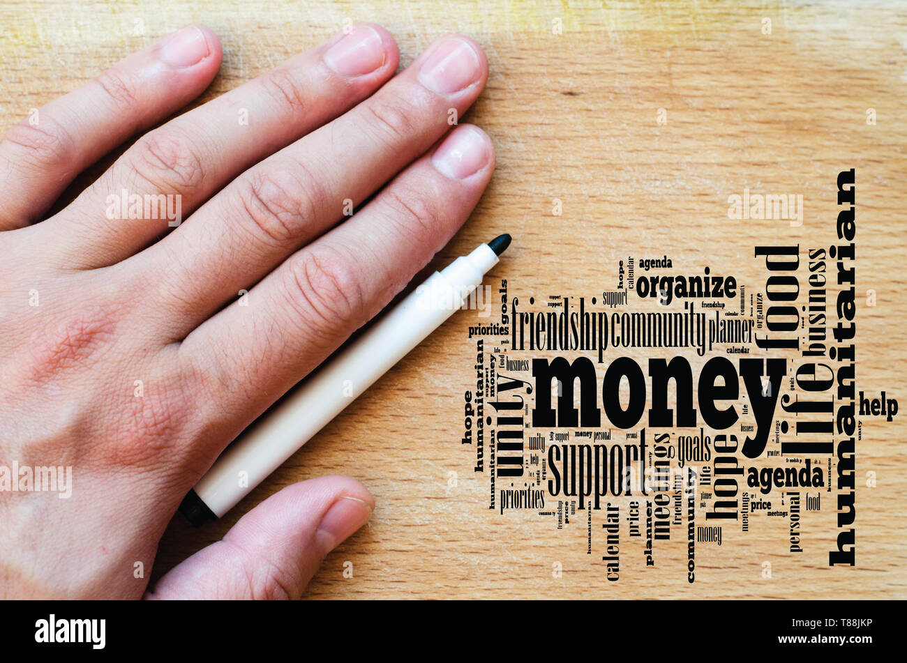 Money word cloud business concept over wooden background Stock Photo