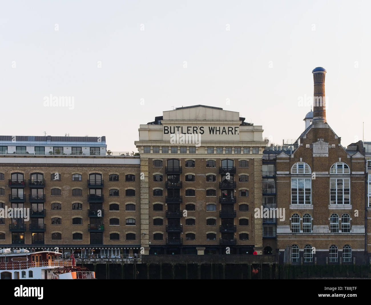 Historic Butler's Wharf building on the south bank of the River Thames at dusk, London, UK. Stock Photo