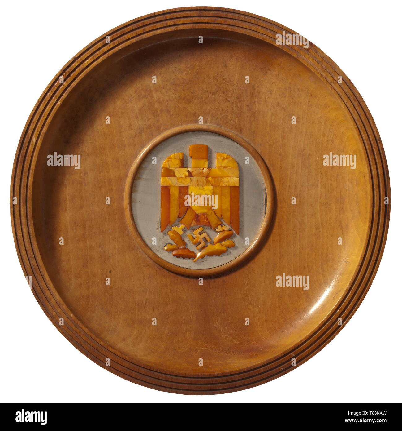 Friedrich-Karl Florian - a cup of honour from the Gauleiter of East Prussia Erich Koch (1886 - 1986) Large wood plate with silver centre and applied national eagle of amber, on the back the dedication 'To fellow party member, comrade and friend Friedrich-Karl Florian Gauleiter of the NSDAP Düsseldorf with cordial birthday greetings from the Gau of Golden Tears Erich Koch Königsberg/Prussia 4 February 1939' and a plaque of the amber industry. Diameter 33 cm. historic, historical, 20th century, 1930s, NS, National Socialism, Nazism, Third Reich, German Reich, Germany, German,, Editorial-Use-Only Stock Photo