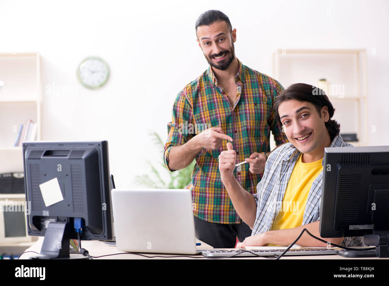 Two it specialists working in the office Stock Photo