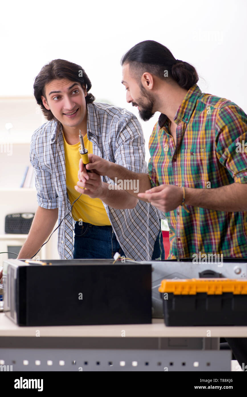 IT engineers working on hardware issue Stock Photo