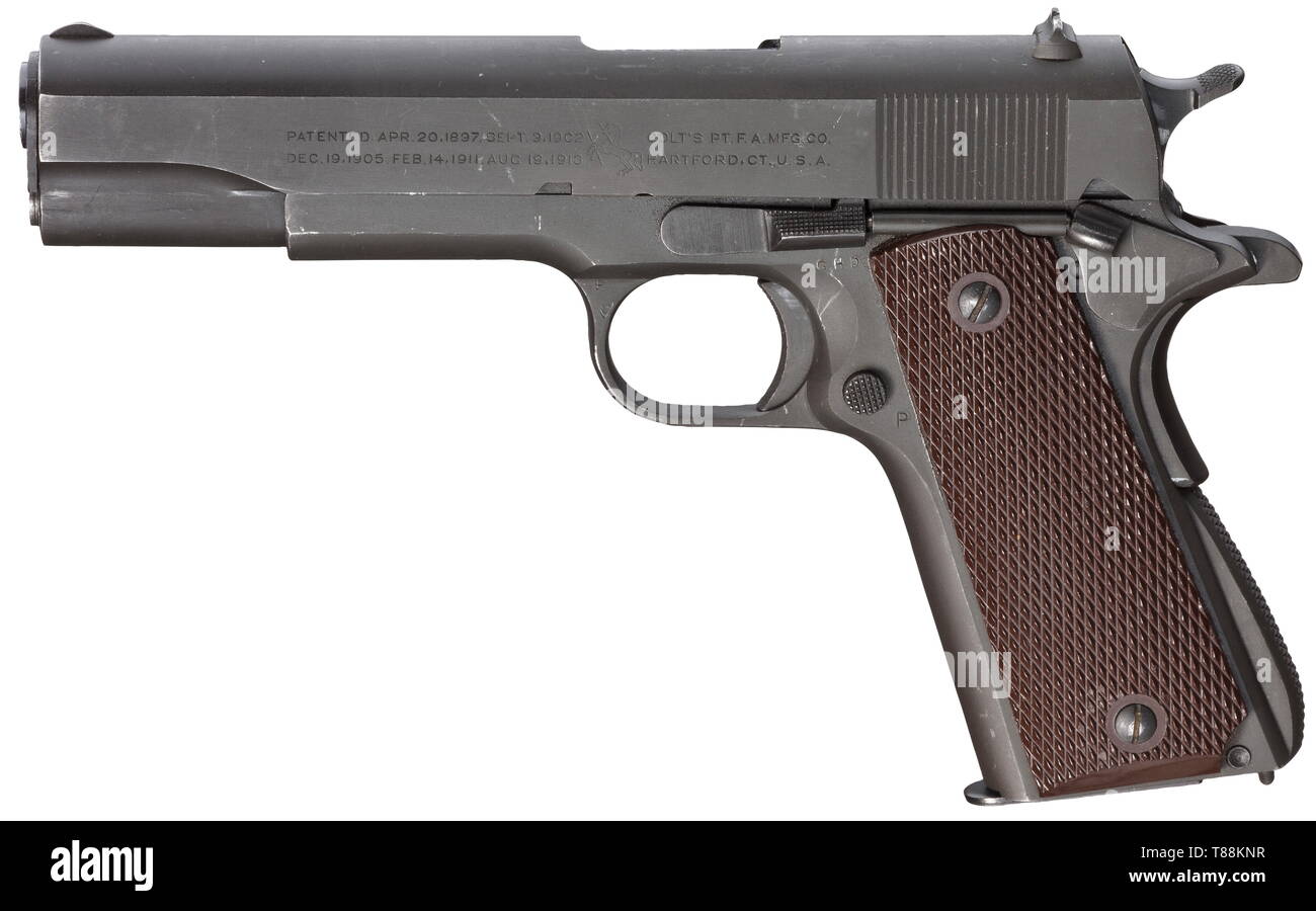 A Colt mod. 1911 A 1 Cal..45 ACP, no. 910387. Bright bore. Production year 1943. Proof-marked 1993. Standard inscription on both sides. Inspector's acceptance 'GHD' with crossed cannons. Complete, original, dark, grey-green phosphatising. Flawless dark brown plastic grip panels. Magazine. Top item in new condition. Erwerbsscheinpflichtig. historic, historical, USA, United States of America, American, object, objects, stills, clipping, clippings, cut out, cut-out, cut-outs, 20th century, Additional-Rights-Clearance-Info-Not-Available Stock Photo