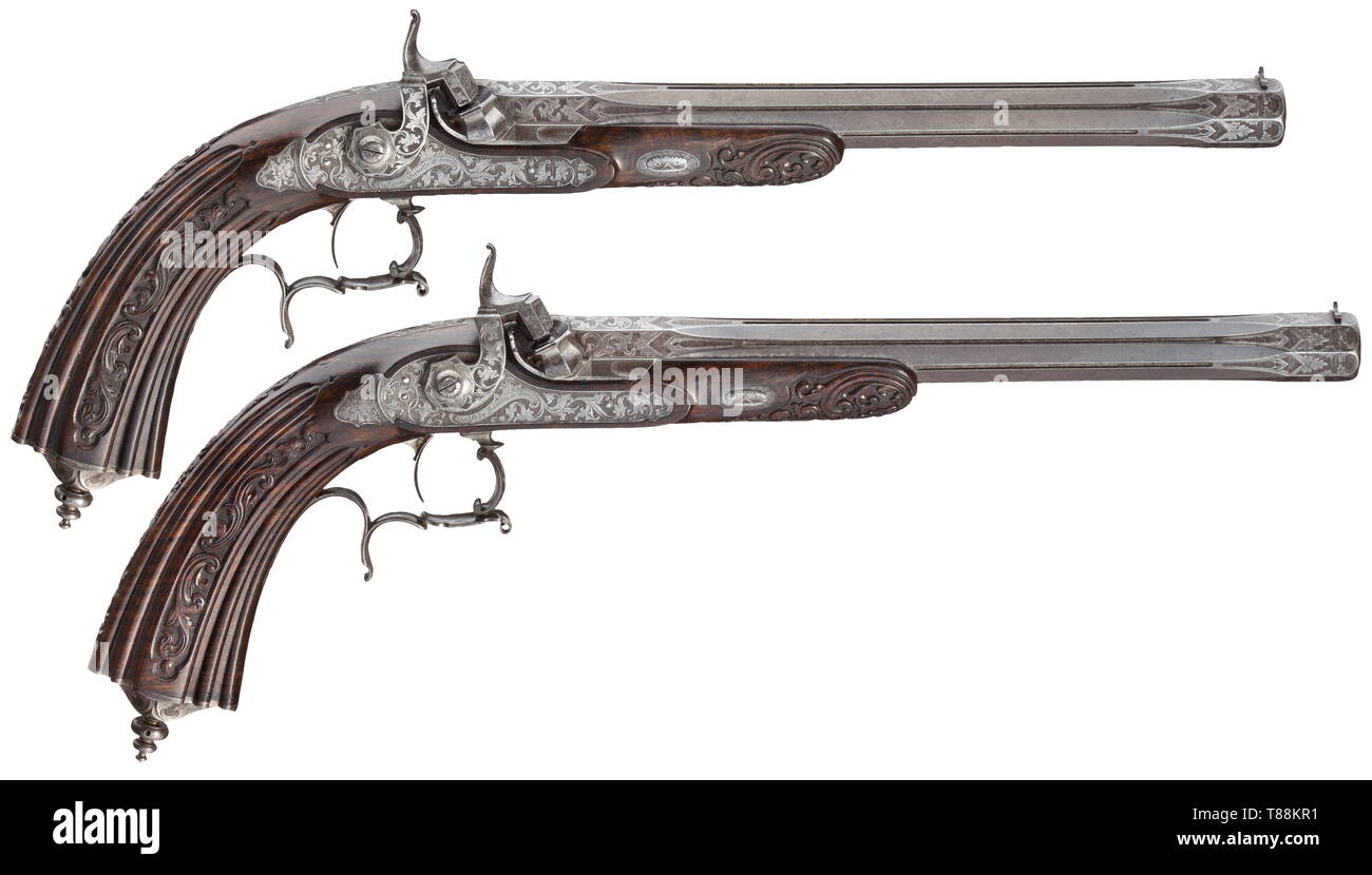 A cased pair of percussion pistols, Gastinne-Renette, Paris, dated 1845 Octagonal barrels with twelve-groove rifled bores in 12.5 mm calibre with patent breechblocks, engraved with leaves decorations at the muzzle and at the breech, in the middle offset flutes. The surfaces of the barrels each signed in gold 'Gastinne Renette a Paris'. The undersides of the barrels with marks of Albert Renette, year of manufacture '1845' as well as weapon number '400'. The percussion locks with engraved decorative leaves against a tarnished background, with repea, Additional-Rights-Clearance-Info-Not-Available Stock Photo
