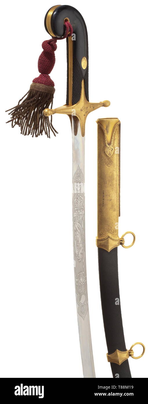 Juan Per¢n (1895 - 1974) - President of Argentina A gift sabre for the French general Lattre de Tassigny on the occasion of his visit to Argentina in 1947. 'Mameluke' sword, the blade etched on both sides of the forte (with the Argentine coat of arms), no maker´s mark. Matt gilt hilt with chequered, black lacquered wooden grip scales (a few small chippings), attached to it a dark red tassel. Also a black, coarsely lacquered sheet steel scabbard with matt gilt mounts decorated in relief and two movable suspension rings. Signs of age. Length circa , Additional-Rights-Clearance-Info-Not-Available Stock Photo