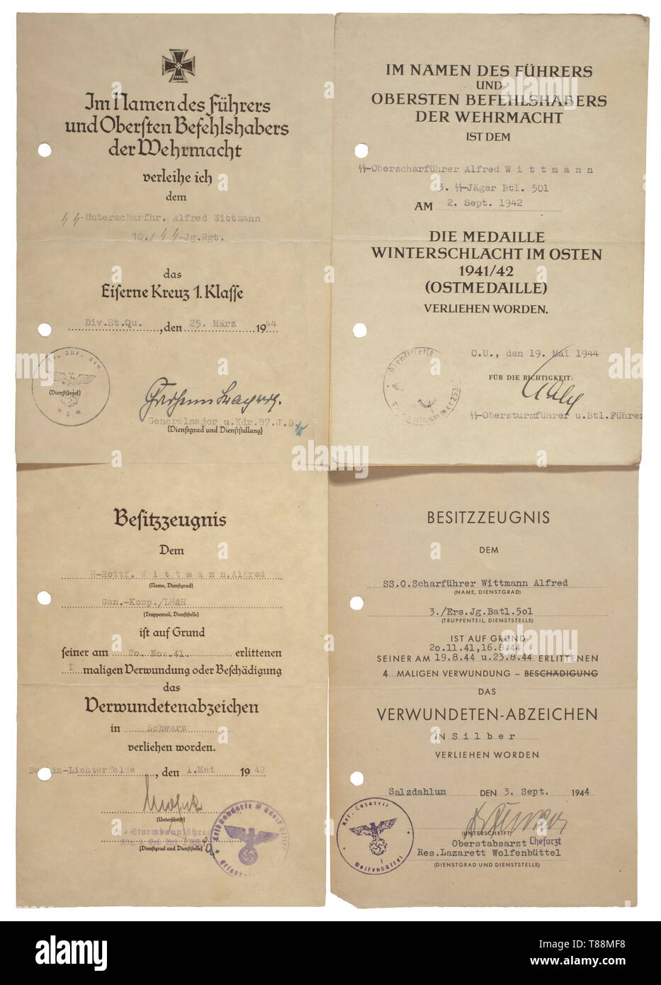 A grouping of Alfred Wittmann SS-Jäger Battalion 501 - Warsaw uprising Award documents for the Iron Cross 1st Class, issued 25 March 1944 by '10./SS-Jg.Rgt.' with original signature of v. Strachwitz, for the Eastern Front Medal issued by '3. SS-Jäger Btl. 501', for the Wound Badge in Black and in Silver issued by 'Gen.-Komp./LSSAH' and 'Jg.Batl. 501' respectively with original signature of Mohnke and a Chief Staff Doctor. Promotion documents to Unter- as well as Oberscharführer, five attestations for 27 days engaging in anti-partisan operations, fifteen close combat days an, Editorial-Use-Only Stock Photo