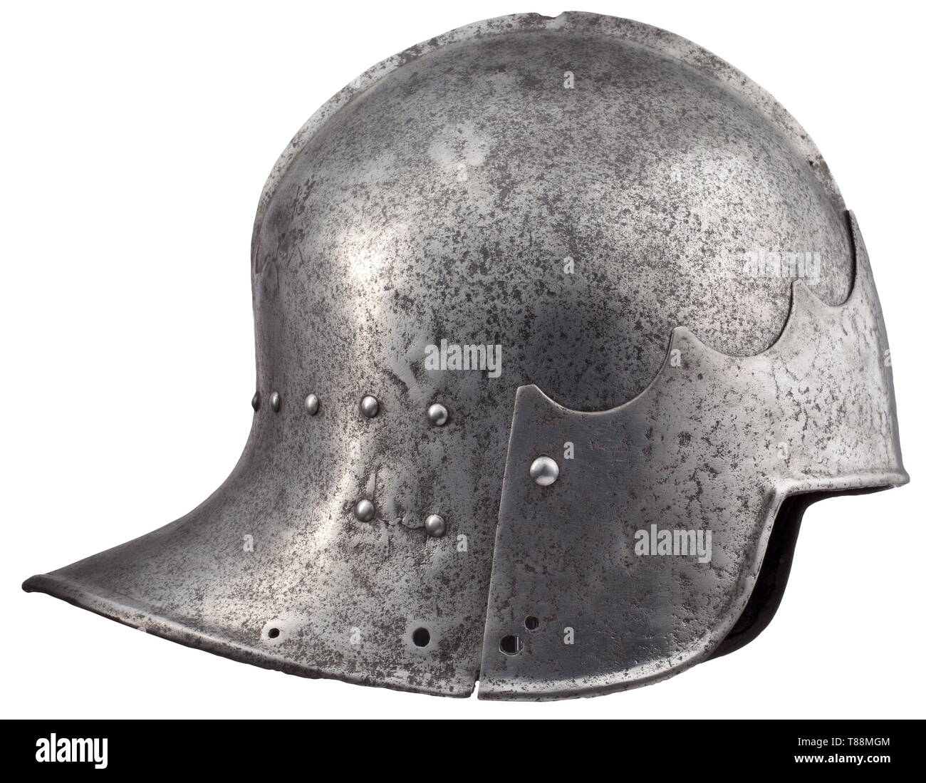 An Italian tailed sallet circa 1450-70. With one-piece skull, medial ridge developing into a flattened low keel pierced for a crest, drawn-out to a short tail with angular inwardly-turned edge, face-opening rounded at the sides, the edge now finished without a turn, struck with two marks at the rear, one a coronet over a Gothic letter, the other a split cross (each rubbed), fitted with later brow-plate, and later rivets for the chin-strap and lining-band.Height 24.3 cm. Weight 2330 g. A celata all´italiana with a skull of this form, with no provi, Additional-Rights-Clearance-Info-Not-Available Stock Photo